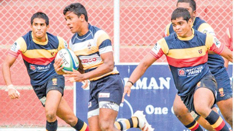 St. Peter’s College hooker Methusara Vishmika races ahead beating the Trinity College defence in their Dialog inter school league rugby match at Pallekele yesterday. The Peterites won 22-10