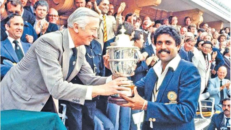 Indian captain Kapil Dev receiving the World Cup