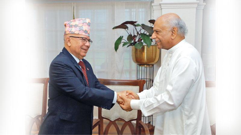 Minister Dinesh Gunawardena welcomes former Nepal Prime Minister Madhav Kumar at Temple Trees