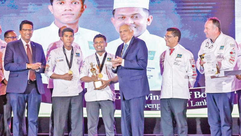 President Ranil Wickremesinghe with two of the prize winners and other officials at the ‘Bocuse d’Or 2023’ awards ceremony at Waters Edge, on Sunday. 