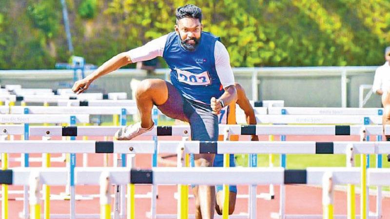 Janidu Lakvijaya going over the hurdle