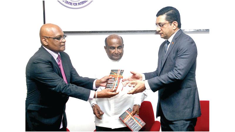 Author Dr. Rohan Gunaratna presents his book to Foreign Minister Ali Sabry and Speaker Mahinda Yapa Abeywardena