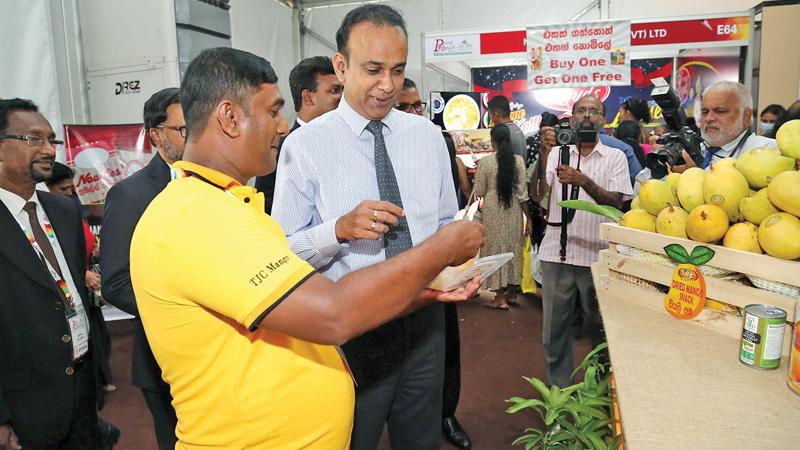 Minister of Plantation Industries Dr. Romesh Pathirana at a stall