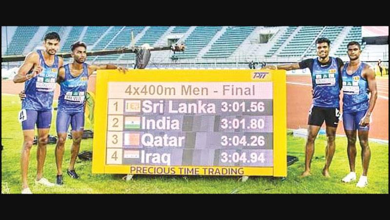 Sri Lanka’s 4x400m men’s relay quartet celebrating their golden run at the Asian Athletics Championship in Bangkok last month. From left: Rajitha Rajakaruna, Kalinga Kumarage, Aruna Dharshana and Pabasara Niku