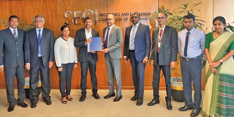 SEC and CFA Society officials after signing the MoU.