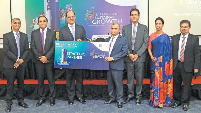 The presentation of the sponsorship to President CA Sri Lanka, Sanjay Bandara. CEO, CSE Rajeeva Bandaranaike, Thivanka Jayasinghe, Arjuna Herath, Heshana Kuruppu,  Chamila Cooray and  Prasanna Liyanage look on. Pic: Wimal Karunatilleke