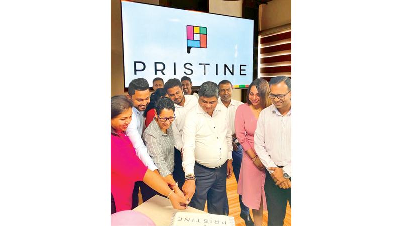 Cutting the cake at the launch of the new brand identity