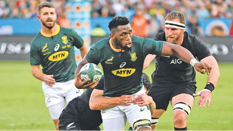 South Africa captain Siya Kolisi attempts to break away from a tackle