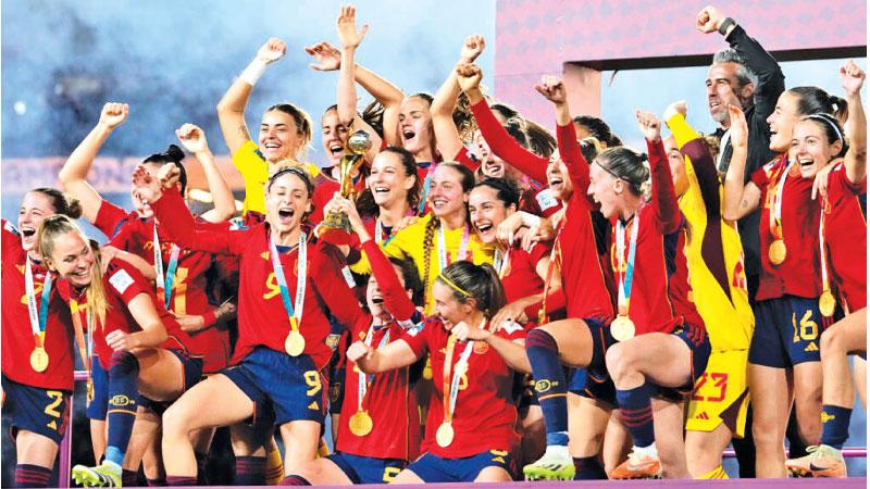 The triumphant women’s football team of Spain celebrate on the podium winning the World Cup by beating England 1-0 in last Sunday’s final in Sydney, Australia