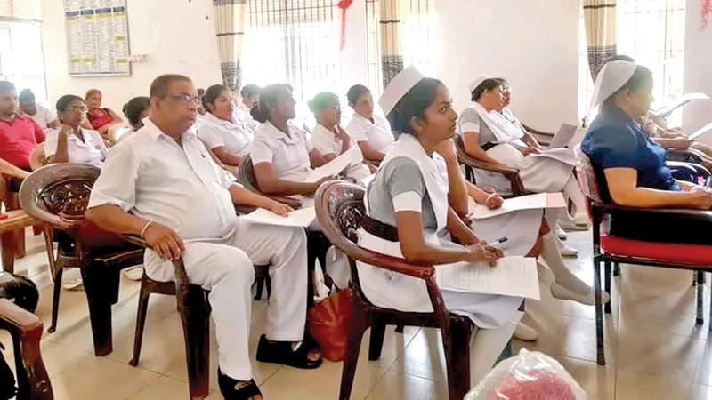 A workshop for health employees including nurses and sisters.