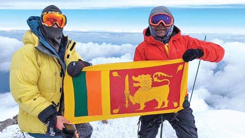 Johann Peiris and fellow  climber poses with Sri Lanka’s flag on top of Mt. Elbrus.