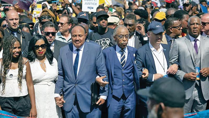 Martin Luther King III and the Rev. Al Sharpton lead the march during the 60th anniversary of the March on Washington. (Tom Brenner/For the Washington Post )