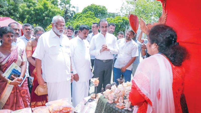 Ministers Dr. Ramesh Pathirana, Douglas Devananda and invitees at the opening ceremony.