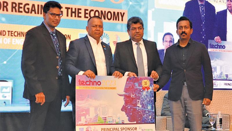 CEO of Sri Lanka Telecom PLC, Janaka Abeysinghe and Group Chief Marketing Officer of SLT-Mobitel, Prabhath Dahanayake present  the mock cheque to Chairman of Techno 2023 and President-Elect of the Council of the IESL, Prof. Ranjith Dissanayake.