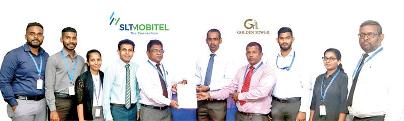 General Manager, Consumer Business Support, SLT, Pushpakumara Samarasinghe and Director of Golden Tower Sachithananthan Srijayan exchange the agreement.