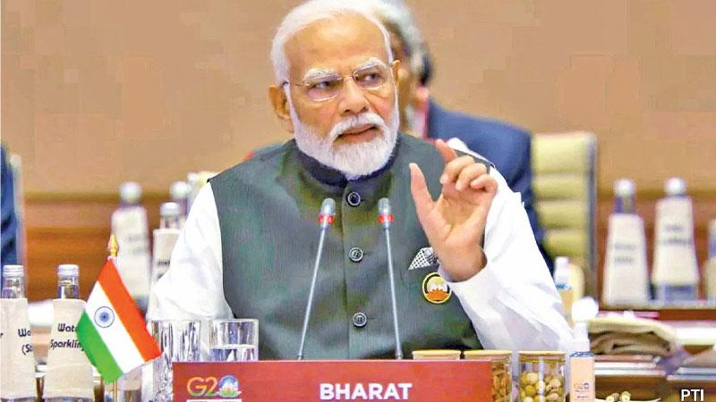 Indian Prime Minister Narendra Modi addressing the G20 Summit, with “Bharat” country name tag.